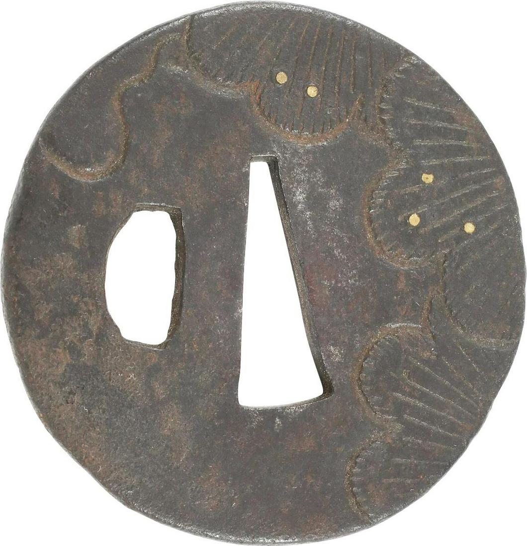 JAPANESE SWORD GUARD TSUBA: Edo Period, 1603-1868 Circular iron, 2 3/8 diameter for wakizashi, the short sword. Single riobitsu. The field boldly chiseled in aquatic foliage both sides with brass pique accents (two piques lackin