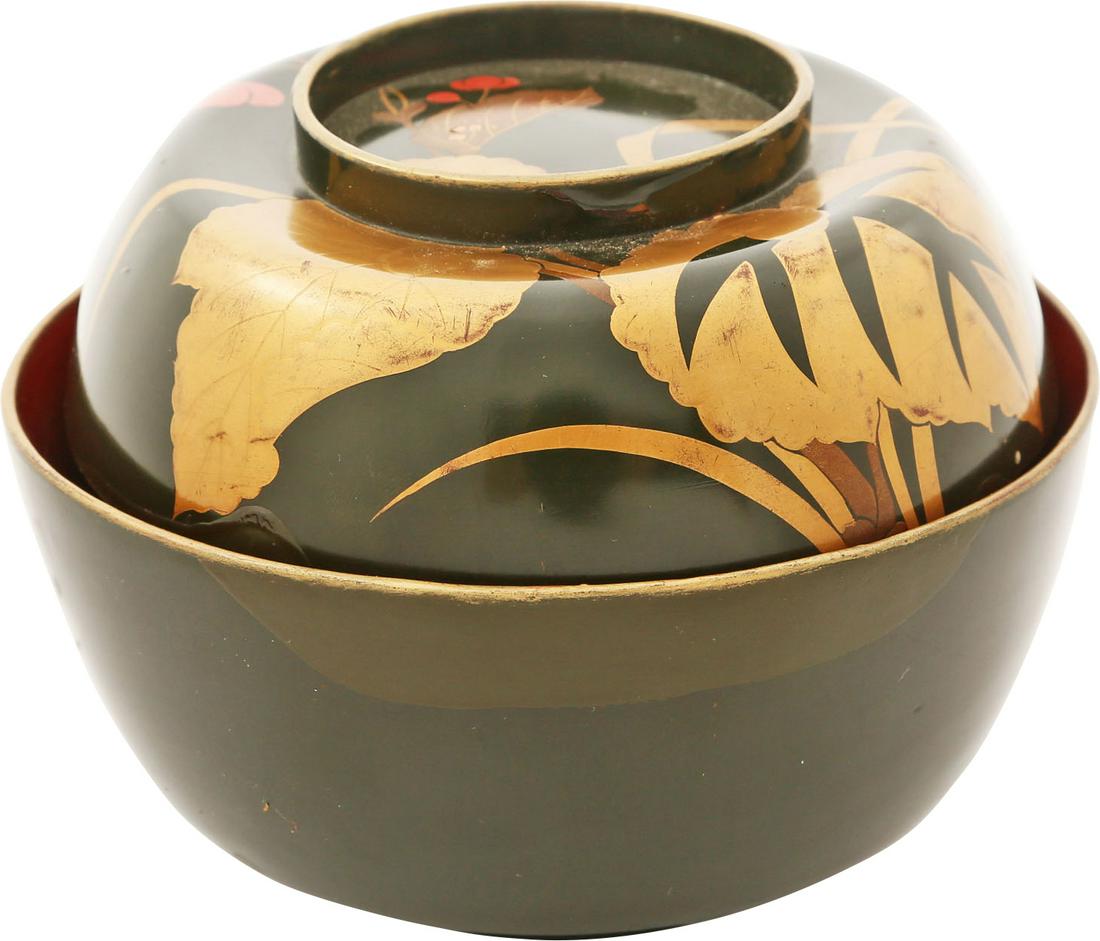 JAPANESE LACQUERED BOWL, OWAN: Meiji period, before 1912. 4 7/8" diameter with green exterior and dark orange inside. The top with elaborate aquatic foliage in multiple colors including true gold and nacre sparkles. The motif conti