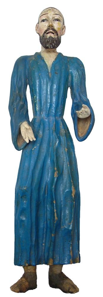 A FINE SPANISH COLONIAL SANTOS FIGURE: 18th-early 19th century. 15 1/2 inch height, the lean figure approaching emaciation with elongated lower body and sandals. The face particularly sensitively done with textured beard emulating the robe