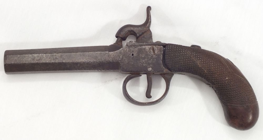 ENGLISH PERCUSSION POCKET PISTOL C.1850: 3" .45 cal barrel. Walnut bag shaped grip, checkered and inlaid with a brass escutcheon. Main spring lacking, screws replaced and damages.