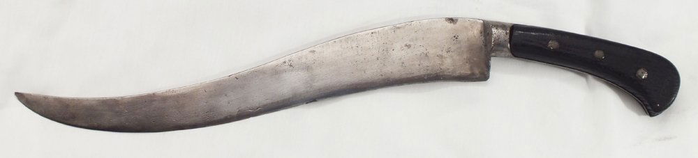 LARGE 17TH CENTURY INDO-AFGHAN PESH KABZ: Iron, with 12 1/8" broad recurved blade. Black wood scale grips secured with three large rivets. Blade with pitting and tool marks.