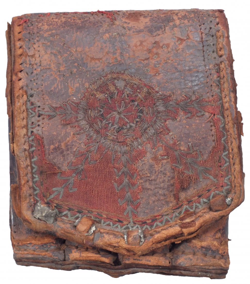ANTIQUE OTTOMAN BULLET POUCH C.1700-1800.: For flintlock musket C.1700-1800. Leather with four cylindrical compartments for wood cartridges, each of which held a charge and ball for muzzle loading. 4 1/4" x 5 1/4". The front flap overlaid with
