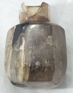 EGYPTIAN ROCK CRYSTAL SCENT BOTTLE C.2200 B.C.: 2 1/16" height. Faceted body with flat bottom for an upper class house. (Peasant vessels are round bottom for dirt floors.) Faceted neck and straight tubular interior as common for these which held ex