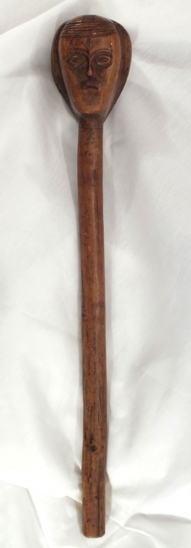 MBUNDU WOOD STAFF EX. CHRISTIES LONDON: Angola, southwest Africa. 17 1/4" length with terminal carved as a female(?) head with large ordered hair arrangement comprising two tapered bundles flanking a depressed medial. Angular face with clan