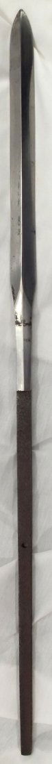 ANTIQUE JAPANESE SPEAR HEAD YARI.: Large armor piercing example. Edo period. 22" length with 11 1/8" point of broad triangular section, with a large broad groove on the largest fact. Single hole tang, Point with a little pitting at the