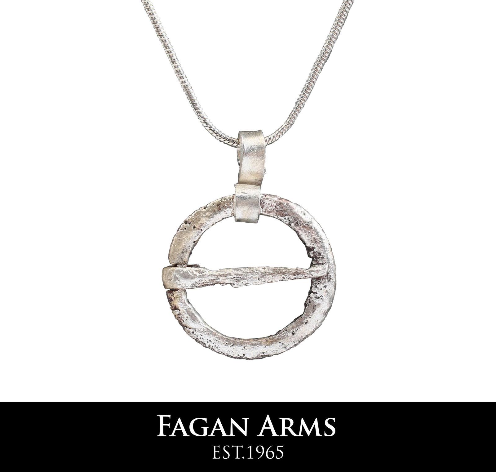 VIKING PROTECTIVE BROOCH NECKLACE C.870-1066: Cambridgeshire, England. Circular bronze, about 7/8" diameter with rounded front and flat back. The edge notched to seat the tapered cross pin. Surface textured from burial. Worn in numbers on the sur