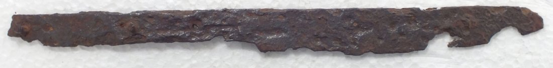CRUSADER'S SIDE KNIFE C.1100-1250.: C.1100-1250. Found along the Crusade's route near the Danube. 6 7/8" total length with tapered wedge section blade and tang pierced for bone or wood scales. Two securing pins and a rivet for scale gri