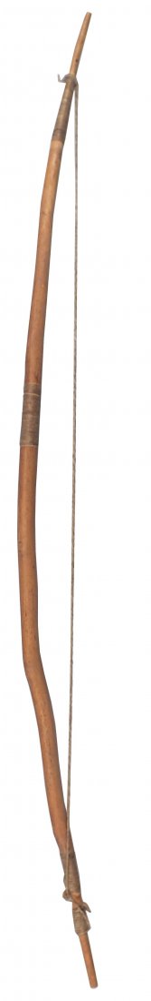 ANTIQUE AFRICAN PYGMY BOW: 27" total length, tapered from the middle and made from a natural limb. Terminals and 1/3 point wrapped with sinew. Original plant fiber bow string secured at one end and tied the other with a wrap of
