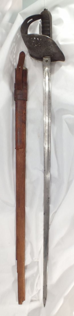ANTIQUE BRITISH M.1897 INFANTRY OFFICER'S SWORD.: Hilt pierced with foliage and crowned GRV cipher. Wire wrapped leather covered grip complete with the surface a little congealed. Hilt shows smooth gray/brown patina. 32 1/2" straight blade with inset
