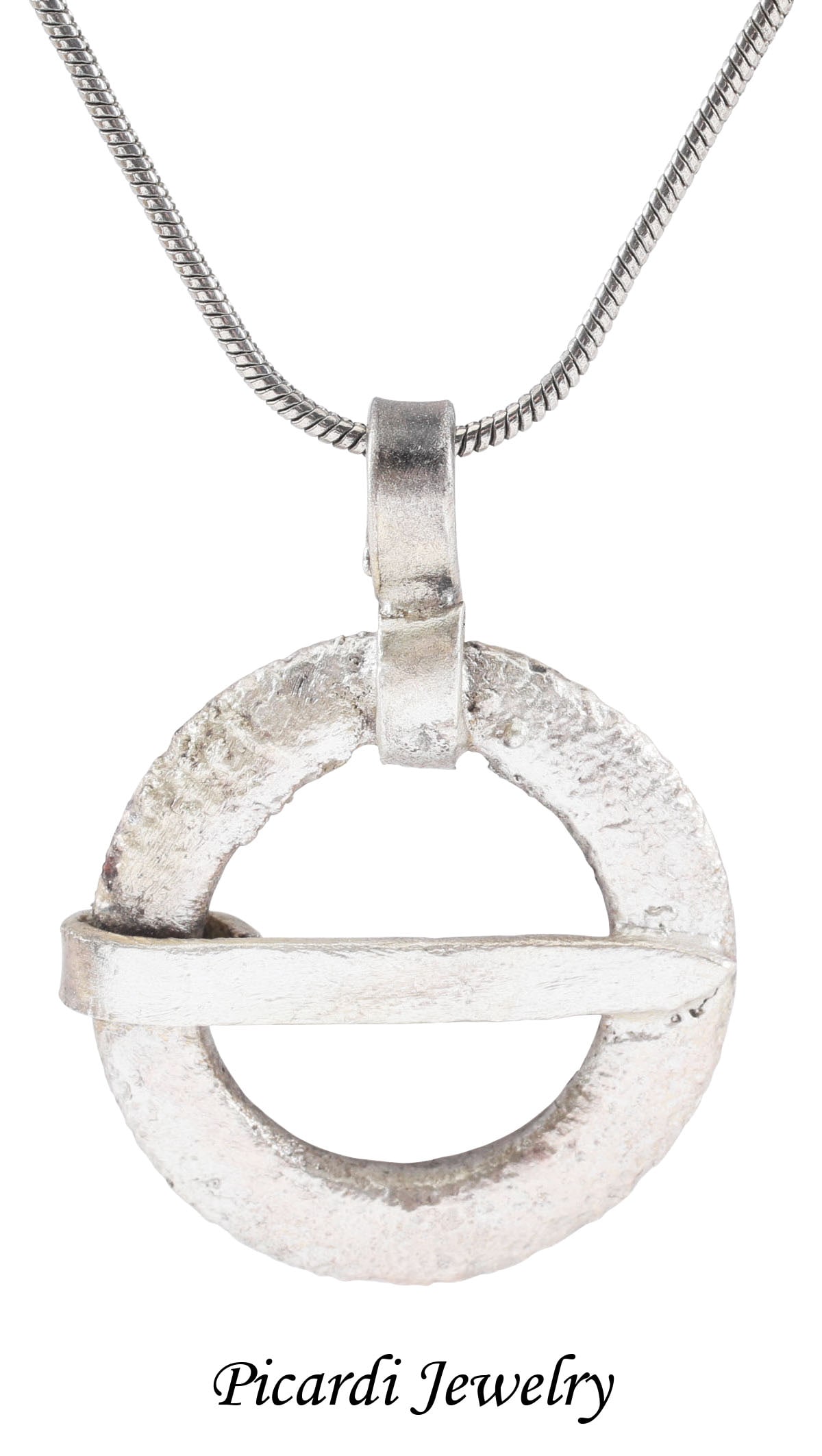 VIKING PROTECTIVE BROOCH NECKLACE, C.870-1066: Cambridgeshire, England. Circular bronze, slightly over 7/8” (0.90”) diameter of rounded faces front and back, and tapered cross pin. Surface textured from burial. Worn in numbers on the s
