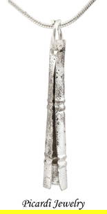 VIKING CONICAL BEAD/PENDANT, 866-1067 AD: Danelaw England. Silvered bronze, over 1 3/8" of elongated conical form with butted seam and pierced terminal with its original suspension ring. Double decorative bands at the top and bottom. These we