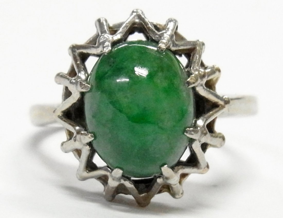 14k White Gold Green Jadeite Jade Solitaire MCM Ring: Title:14k White Gold Mottled Green Jadeite Jade Solitaire Ladies Midcentury Ring Size 5.75Description by Chris / HFA TQKK DB8934:This is a vintage 14k white gold ladies ring featuring a 10 X 8mm oval 