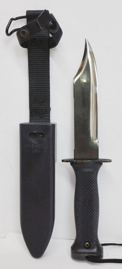 Vintage US Navy Mark 3 MOD Combat Knife with Sheath: Vintage US Navy Mark 3 MOD Combat Knife with Sheath. Displays minor wear. Sheath measures 12 X 1.75 inches. Knife measures 10.75 inches long. Guard is 2.5 inches wide. Weighs less than 2 lbs. Shipping