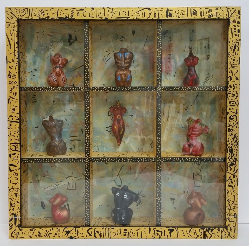 Shane Fero Vocabulary of Torsos Shadowbox Sculpture: Described and Photographed by: Amanda CNX1109 No. 65Title: Shane Fero Vocabulary of Torsos Shadowbox Sculpture Description: A shadowbox sculpture by Shane Fero, a glassblower and artist. The frame of 