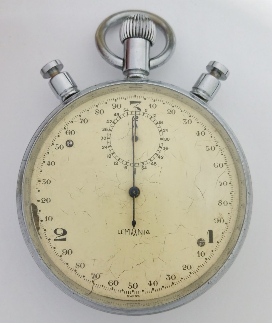 Large Lemania Split Second Stop Watch Timer WWII: Title: Large Lemania Split Second Stop Watch Timer WWII Description: A large split second stop watch by Swiss watch company Lemania. It has a 3 second turnaround and a smaller 2 minute dial. Manufactu