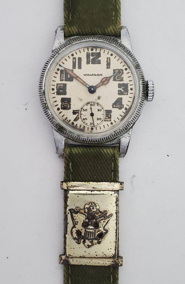 Waltham Ordinance Dep. Watch W/ Photo Locket On Strap: Title: Waltham Ordinance Dept. Watch W/ Sweetheart Photo Locket On Strap Description: Up for auction is a very cool WWII Waltham U.S. Army wrist watch with a sweetheart photo locket crimped onto the s
