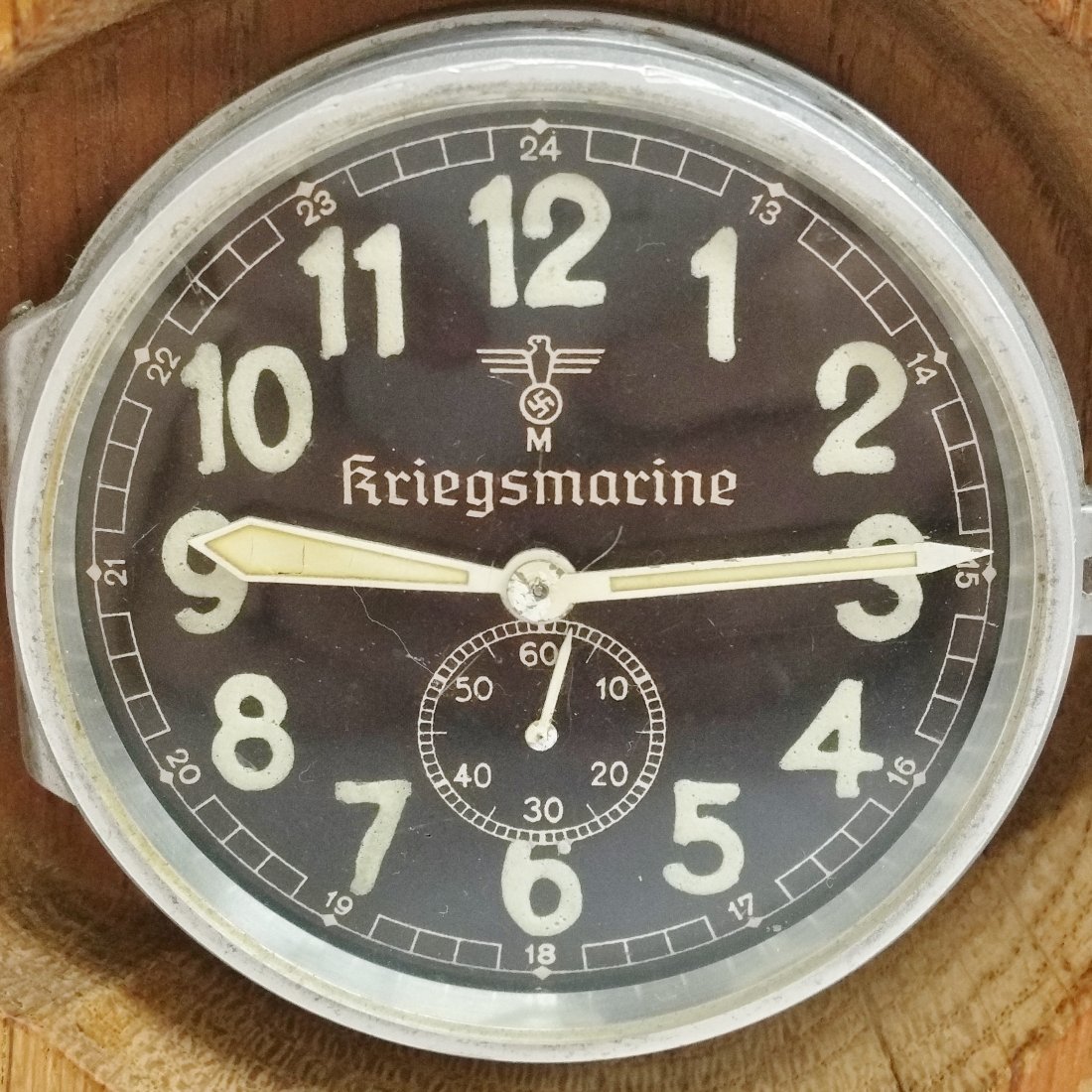 Kriegsmarine KM Radio Room Clock Unusual Winding Mech: Described by: Nikki CNX 1124 4210 Title: Kriegsmarine KM Radio Room Clock Unusual Winding Mechanism Winds From Back Description: Running Kriegsmarine KM radio room clock. Clock features an unusual win