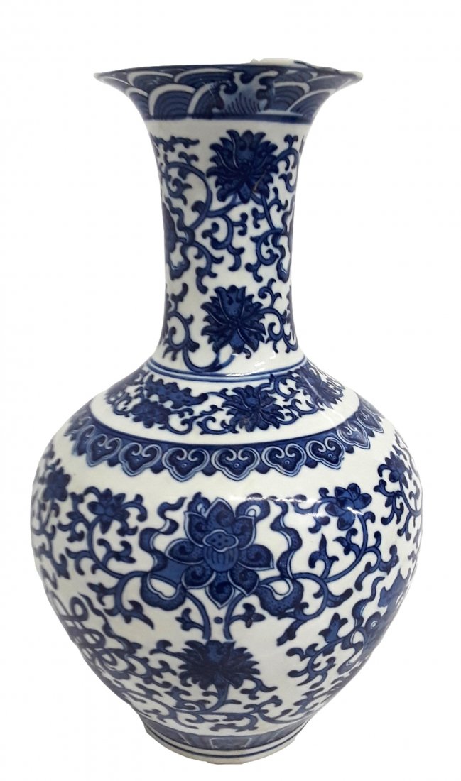 Chinese Blue And White Floral Vase: Described by: Rachel CNX VX 1211 4986 Title: Chinese Blue And White Floral Vase Description: A largely floral pattern with several different symbols throughout. Size in inches: Height: 13.2