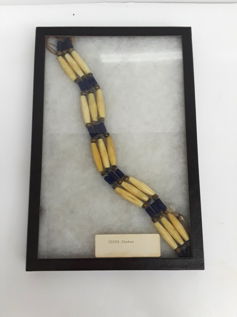 Antique Sioux Beaded Pipestone Trade Choker Necklace: Described By:Rachel HFA VXNAT Title:Antique Sioux Beaded Pipestone Trade Choker Necklace Description: These fair trade beads are made up of brass, bone?, and cobalt blue glass. Type of Piece:N
