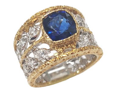 Signed Buccellati 2ct Cushion Cut Sapphire 18k White Yellow Gold Diamond Wide Band Ring w/GIA Report: Title: Signed Buccellati 2ct Cushion Cut Blue Sapphire 18k White & Yellow Gold 0.52ctw Fine Diamond Wide Band Ring w/ GIA Report  Description: Signed Buccellati wide band ring in 18k yellow gold featu