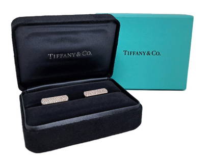 Retail $6500 Tiffany co 18k White Gold Pave Diamond Cufflinks w/ Box: Title:Retail $6500 Tiffany co 18k White Gold Pave Diamond Cufflinks w/ Box Description: 18k white gold Tiffany and co. signed pave diamond cufflinks. Over 120 diamonds, 1mm round totaling approx. 0.64