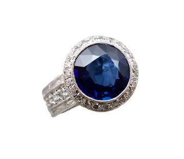 GIA 4.28ct Natural Blue Sapphire 18k White Gold Diamond Ring w/ Report: Title:GIA 4.28ct Natural Blue Sapphire 18k White Gold Diamond Ring w/ Report Description: Natural Blue sapphire surrounded by diamonds and set in a heavy white gold setting. Will fit a size six. Stunn