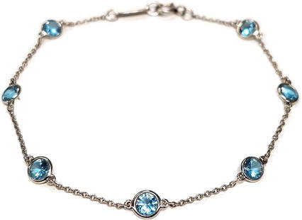 Tiffany & Co. Elsa Peretti Platinum Aquamarine Color By The Yard Station Bracelet: Title: Tiffany & Co. Elsa Peretti Platinum Aquamarine Color By The Yard Station Bracelet Description:The seven lovely aquamarines on this designer bracelet will dot your wrist with lots of sparkle. Ti