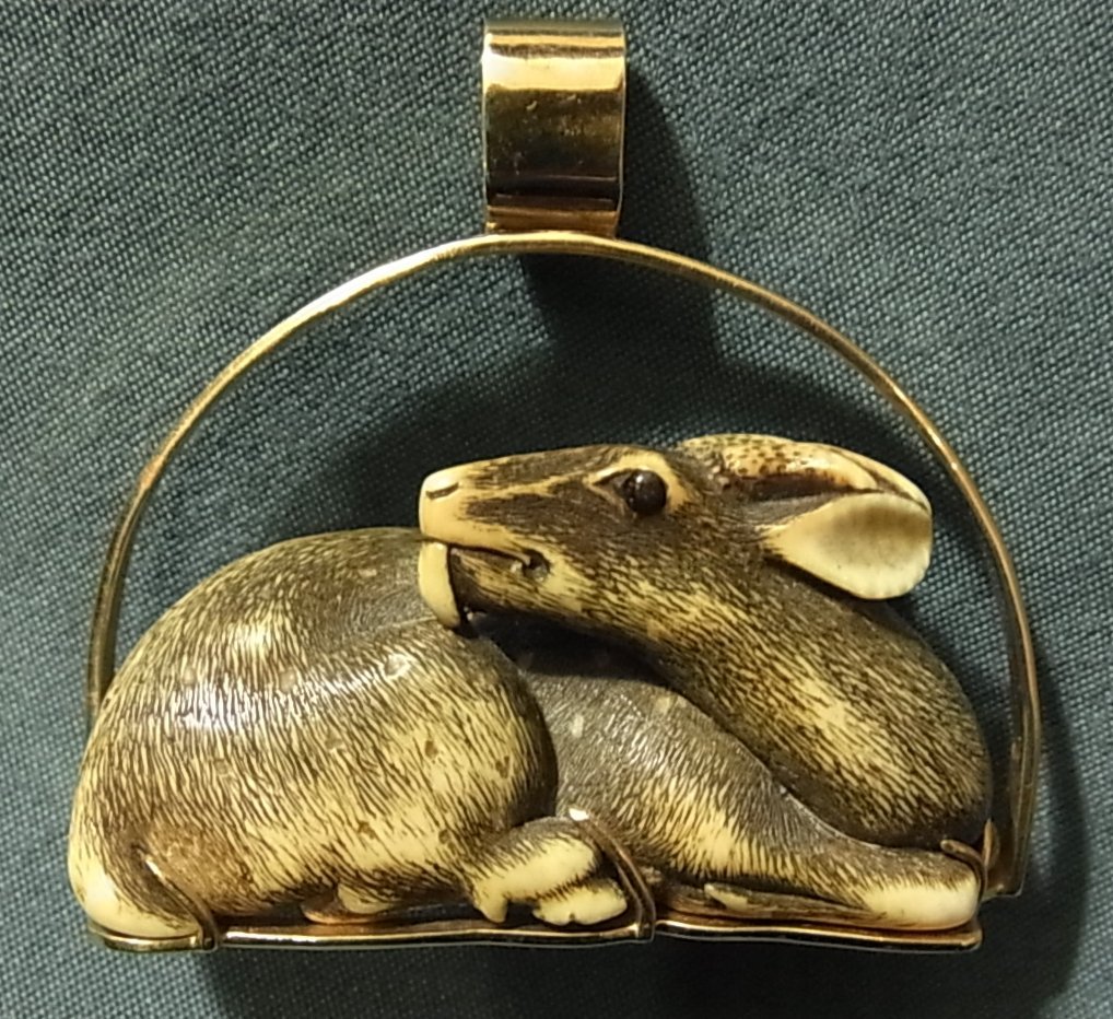 Ivory Deer Stag Netsuke in Heavy 14K Gold Mount: Ivory Deer Stag Netsuke in Heavy 14K Gold Mount Netsuke measures 1" high x 1 7/8" wide x 3/4" deep. Pendant mount is 1 13/16" high x 1 15/16" wide x 13/16" deep overall outside dimensions. Exquisite c