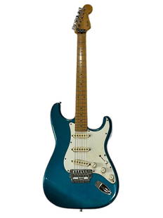 1986 Fender Stratocaster Japan Blue-Green with White Pickguard and Gig Bag Japanese: Described By:  Sam CNX 1527 7797  Title:  Fender Stratocaster Japan Blue-Green with White Pickguard and Gig Bag  Description:  Beautiful Japanese Fender Stratocaster with a gorgeous blue-green body an