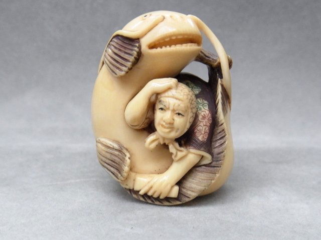 Antique Signed Hand Carved Ivory Man Surrounded By: Antique Signed Hand Carved Ivory Man Surrounded By Giant Koi Cat Fish Japanese Asian Netsuke Description: This is an antique hand carved ivory netsuke showing a human figure completely surrounded by