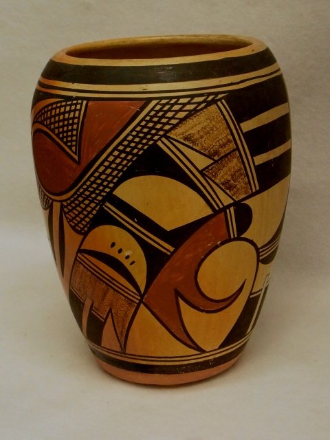 Signed Native American Hopi Laura N. Tomosie Inscri: Description: The item is a signed Hopi Native American pottery vase. The bottom is signed, Laura N. Tomosie, Polacca Arizona. Approx. Dimensions or Size: 5 ½” diameter, 8” high, mouth diameter