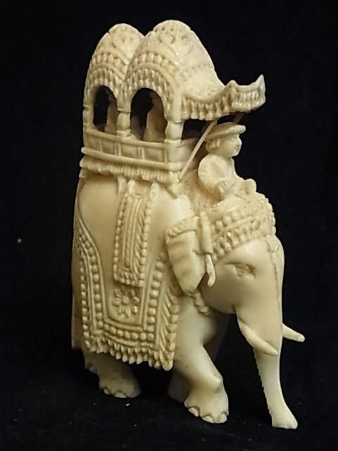 Old Indian Southeast Asia or Chinese Carved Ivory E: Old Indian Southeast Asia or Chinese Carved Ivory Elephant Miniature Figural Group Comprised of Elephant & Howdah Carriage w/ Two Passengers Description: Stunning craftsmanship. A very nicely detailed