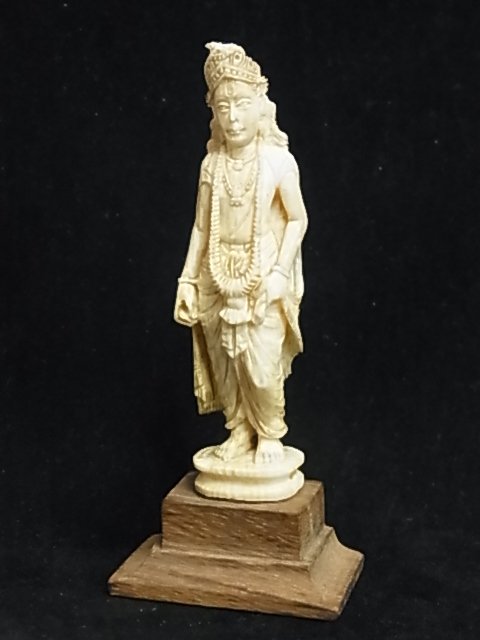 Carved Ivory Hindu Buddhist Goddess God Male or Fem: Carved Ivory Hindu Buddhist Goddess God Male or Female Indian or Southeast Asian Standing Sculpture Miniature Figure Possibly Japanese or Chinese Description: The plinth has age. The figure may be old