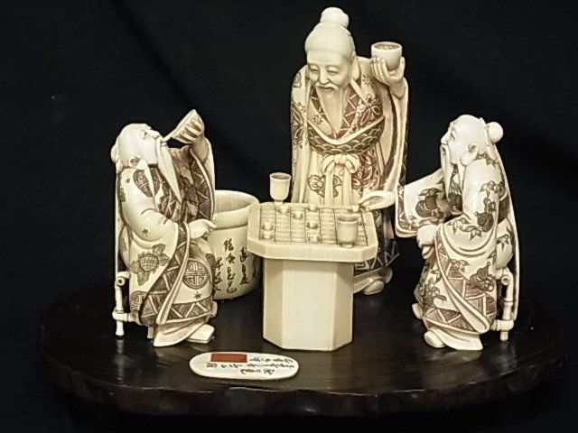 Japanese Carved Ivory Scene Okimono Figures Playing: Japanese Carved Ivory Scene Okimono Figures Playing Board Game Checkers Signed & Inscribed Probably Late Meiji or Showa Description: exquisitely detailed scenic carving of men playing a board game.