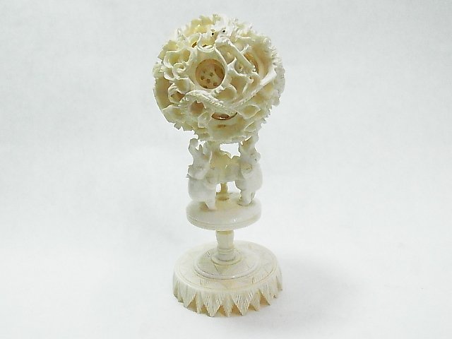 Fine Elephant Ivory Chinese Puzzle Ball Sculpture : Fine Elephant Ivory Chinese Puzzle Ball Sculpture Decoration Pedestal Whimsy Carved Carving Dragon Motif with inlaid Eyes on Eyes on Ball 2 3/4” Diameter 5 3/4” High Including Base Description: Fi