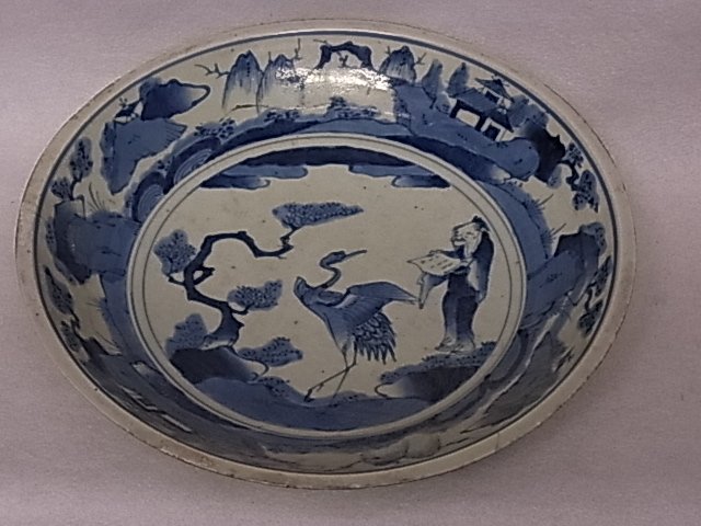 Signed Large Chinese or Japanese Canton or Nanking: Description: Signed Large Chinese or Japanese Canton or Nanking Blue & White Bowl Scholar Artist & Crane Bird in Landscape Identified as Important with Conservation 12” Diameter 2 ½” High. This