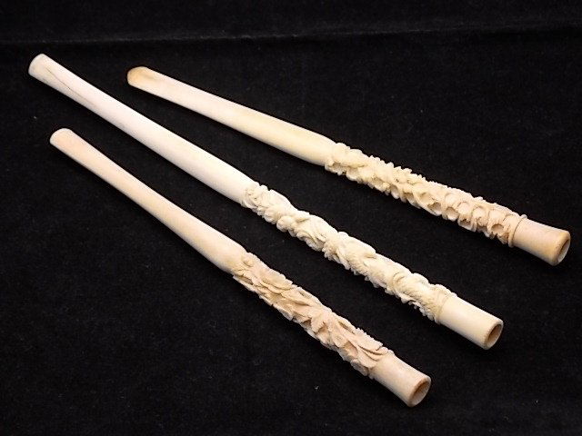 3 Hand Carved Ivory Cigarette Holders Dragon & Flo: 3 Hand Carved Ivory Cigarette Holders Dragon & Floral Motif 7 ½” Average Length Description: While we are sure these were used for tobacco, we have seen them listed as opium collectibles in the p