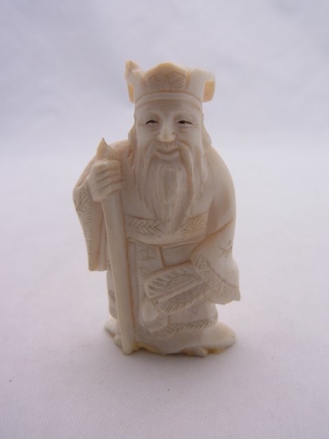 Japanese Signed Carved Ivory Okimono Figure Samura: Japanese Signed Carved Ivory Okimono Figure Samurai Warrior Description: Warrior depicted with armor and weapon. Approx. Dimensions or Size: 2” High Hess Fine Auctions Shipping: Continental