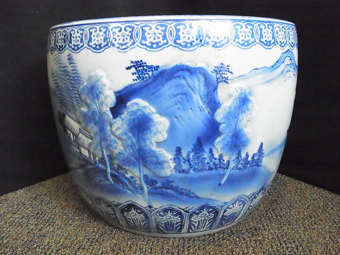 Large Hand Painted Blue and White Koi Fish Bowl Pla: Large Hand Painted Blue and White Koi Fish Bowl Planter Jardinière Japanese or Chinese Pottery Ceramic Porcelain with Embossed Landscape Harbor Motif Upper and Lower Boarders 12” High 15” Diamete