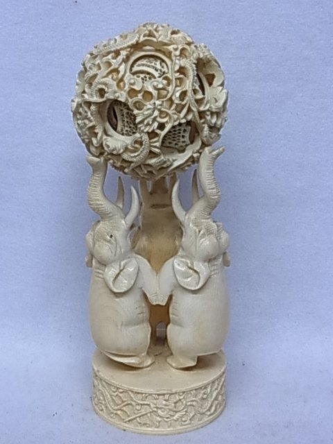 Large Heavy Antique Hand Carved Chinese Ivory Puzzle Ba: Large Heavy Antique Hand Carved Chinese Ivory Puzzle Ball with Elephant Stand 9” Tall Overall 3 ¼” Diameter Hand Carved Plinth Dragon Exterior Motif Description: Large Heavy Antique Hand Carved C