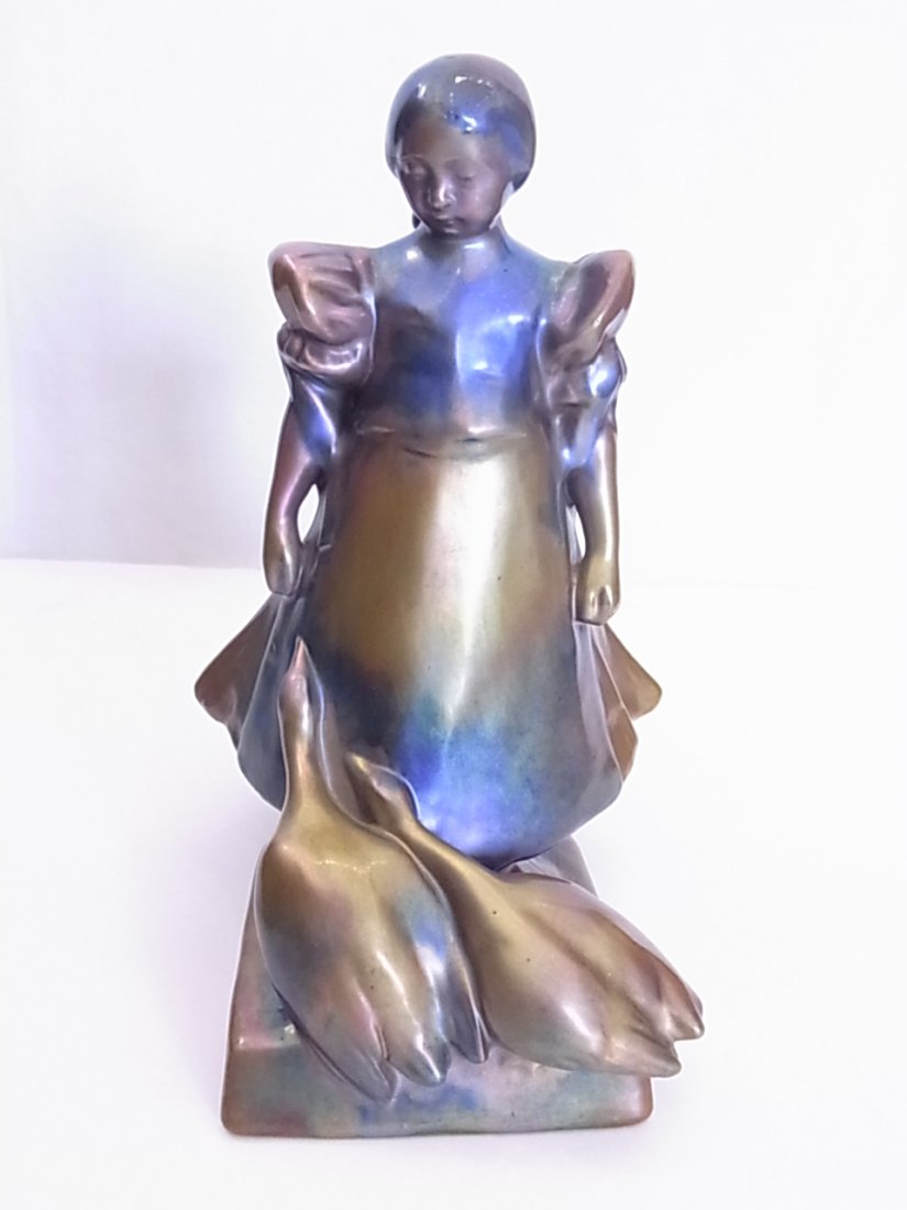 Zsolnay Hungarian Art Pottery Eosin Lustre or Labrador: Zsolnay Hungarian Art Pottery Eosin Lustre or Labrador Glaze Girl With Geese 8666 From Mid-Century Approx. Dimensions or Size: Height: 11”, Width: 7” Depth: 8” Hess Fine Auctions Shipping: We of