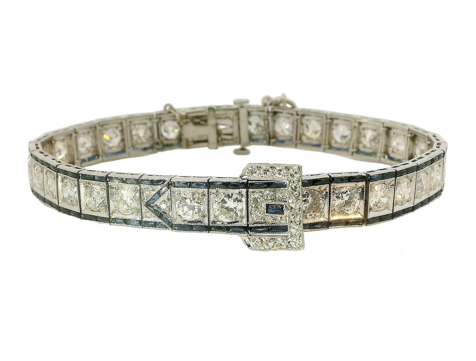 Art Deco Approx 8ctw Old Euro Diamond & Sapphire Buckle Platinum Antique Line Bracelet 1930s: Title: Art Deco Approx 8ctw Old Euro Diamond & Sapphire Buckle Platinum Antique Line Bracelet1930s Description: A beautifully designed buckle style platinum line bracelet featuring a conservative calc
