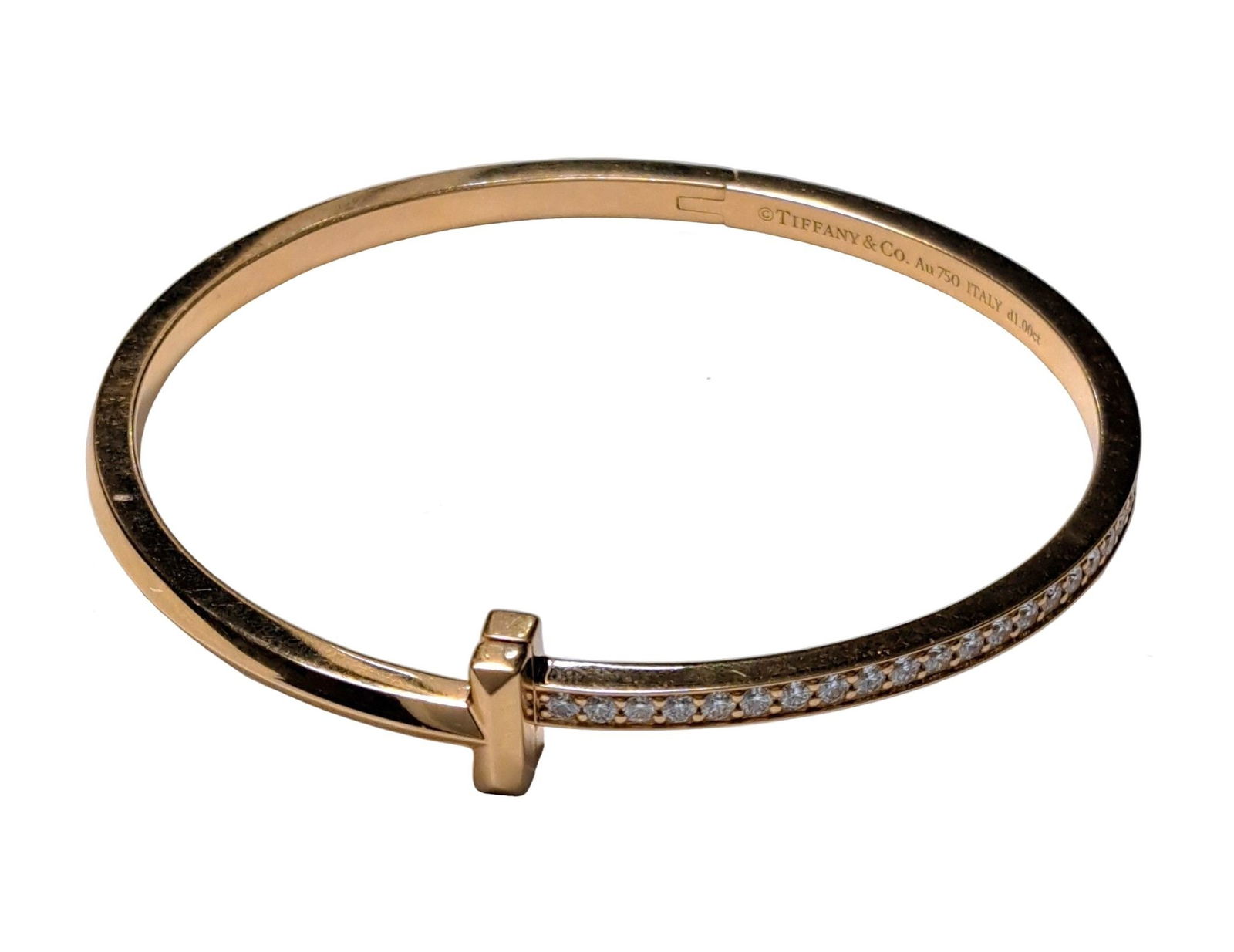 Tiffany & Co 18K Yellow Gold Natural Diamond Narrow T Bangle Hinged 1.00 Ctw 6 ¼ In: Described & Photographed By: Sam / NTEDD HFA DT70234 Title: Tiffany & Co 18K Yellow Gold Natural Diamond T Bangle 1.00 Ctw 6 ¼ In Description:Tiffany & Co 18K Yellow Gold Natural Diamond T Ban