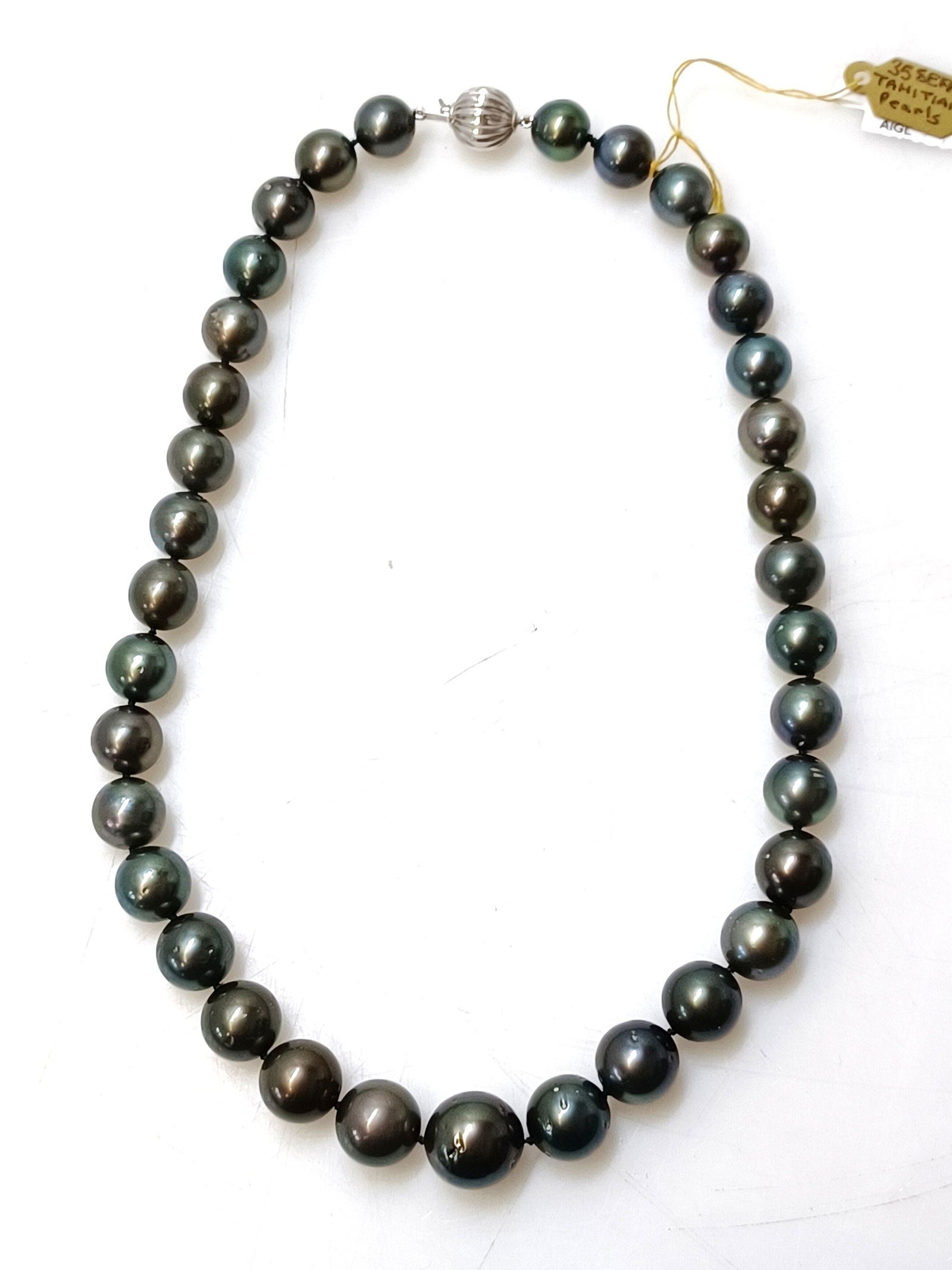 Cultured Tahitian Black Pearl Necklace Ladies 17 Inches Long 14k White Gold Clasp: Described & Photographed By: Rafe CNX 0428 1400 Title: Cultured Tahitian Black Pearl Necklace Ladies 17 Inches Long 14k White Gold Clasp Description:MAIN GEMSTONES Identity: Tahitian Pearl Specie