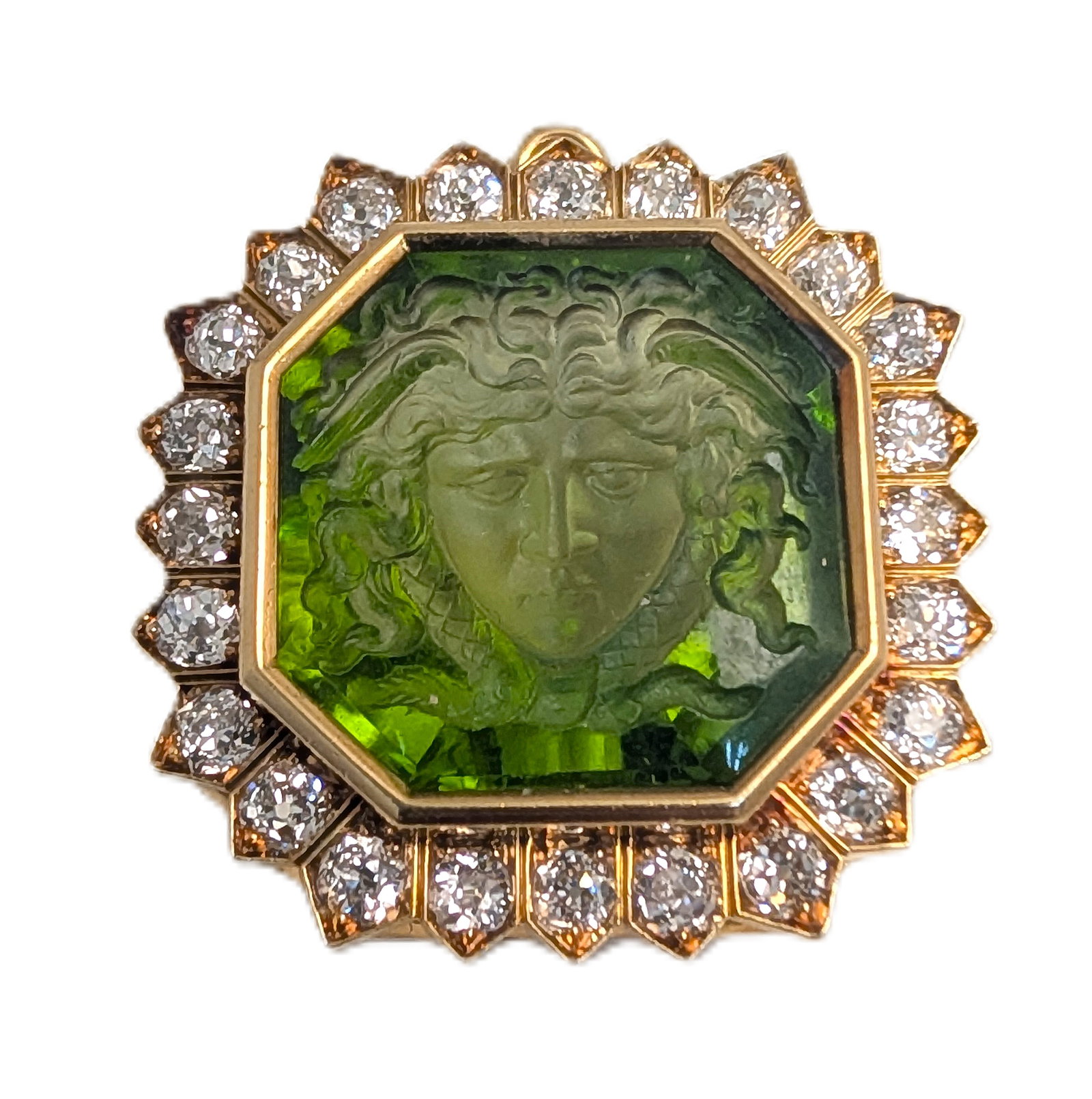 Theodore B. Starr Carved Peridot Medusa Gorgeous Art Nouveau Old Cut Diamond Halo Brooch: Described By:Rachel HFA DT Title:Theodore B. Starr Carved Peridot Medusa Gorgeous Art Nouveau Old Cut Diamond Halo Brooch Description: Three carats of fine, white old-cut melée diamonds, set in a bol