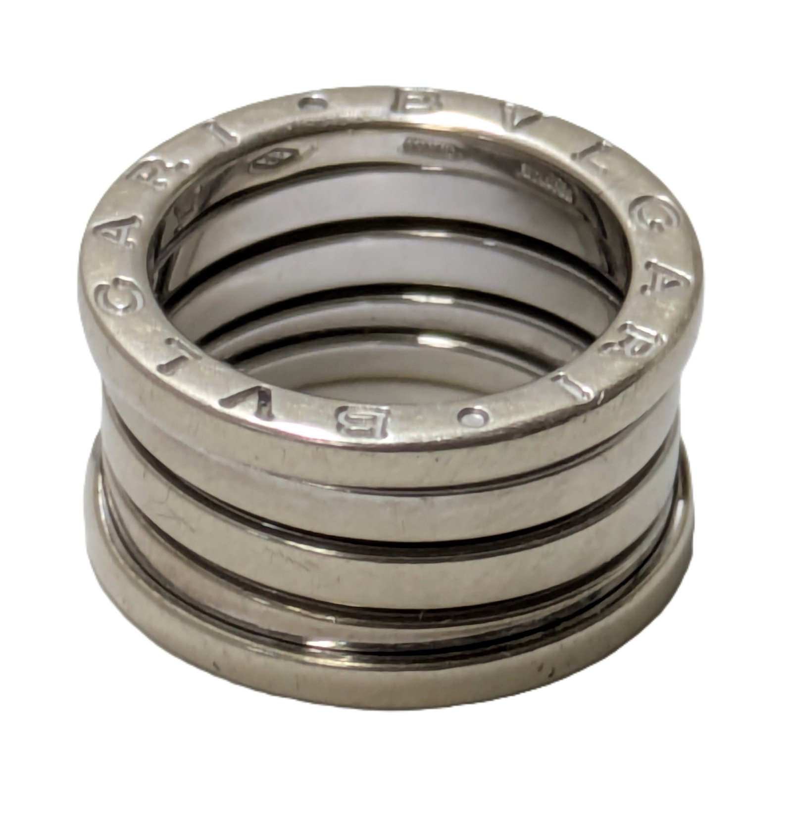 Bulgari Ring B.Zero 1 Three Band 18K White Gold Ring Italy: Described & Photographed By: Adams HFA 71568 Title: Bulgari Ring B Zero 1 Three Band 18 k Gold Italy Description:Bulgari Ring B Zero 1 Three Band 18 k Gold ItalyDescription of ring from Bulgari’s we