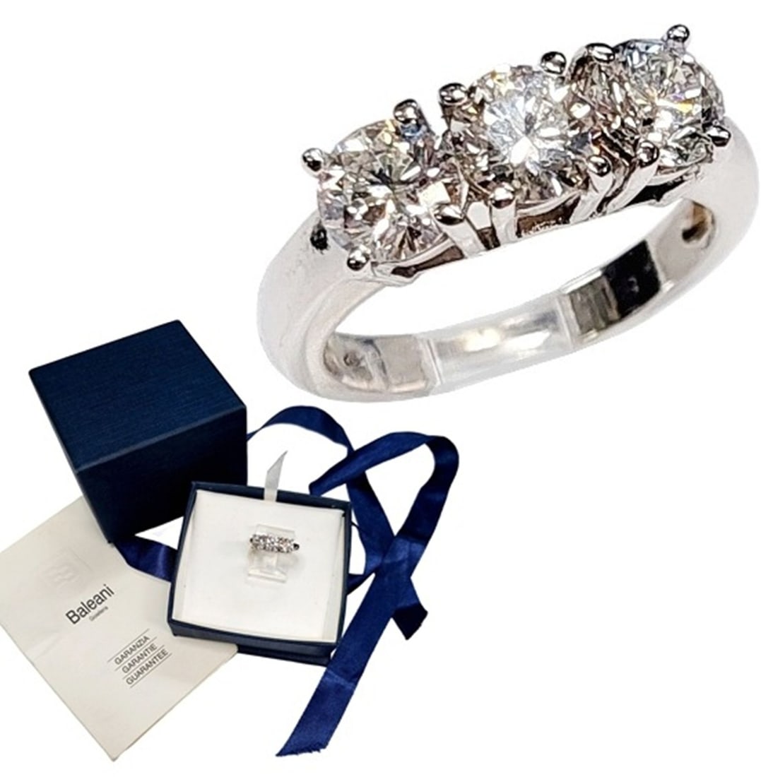 Genuine Gioielleria Baleani Trilogy GIA Diamond 18k White Gold 3 Stone Ring w/ Box & Papers: Described & Photographed By CHRIS AJP GIA / NRDDD 71579 / EST. $4000-$6000 Title Genuine Gioielleria Baleani Trilogy GIA Diamond 18k White Gold 3 Stone Ring w/ Box & Papers Description An ultra fine d