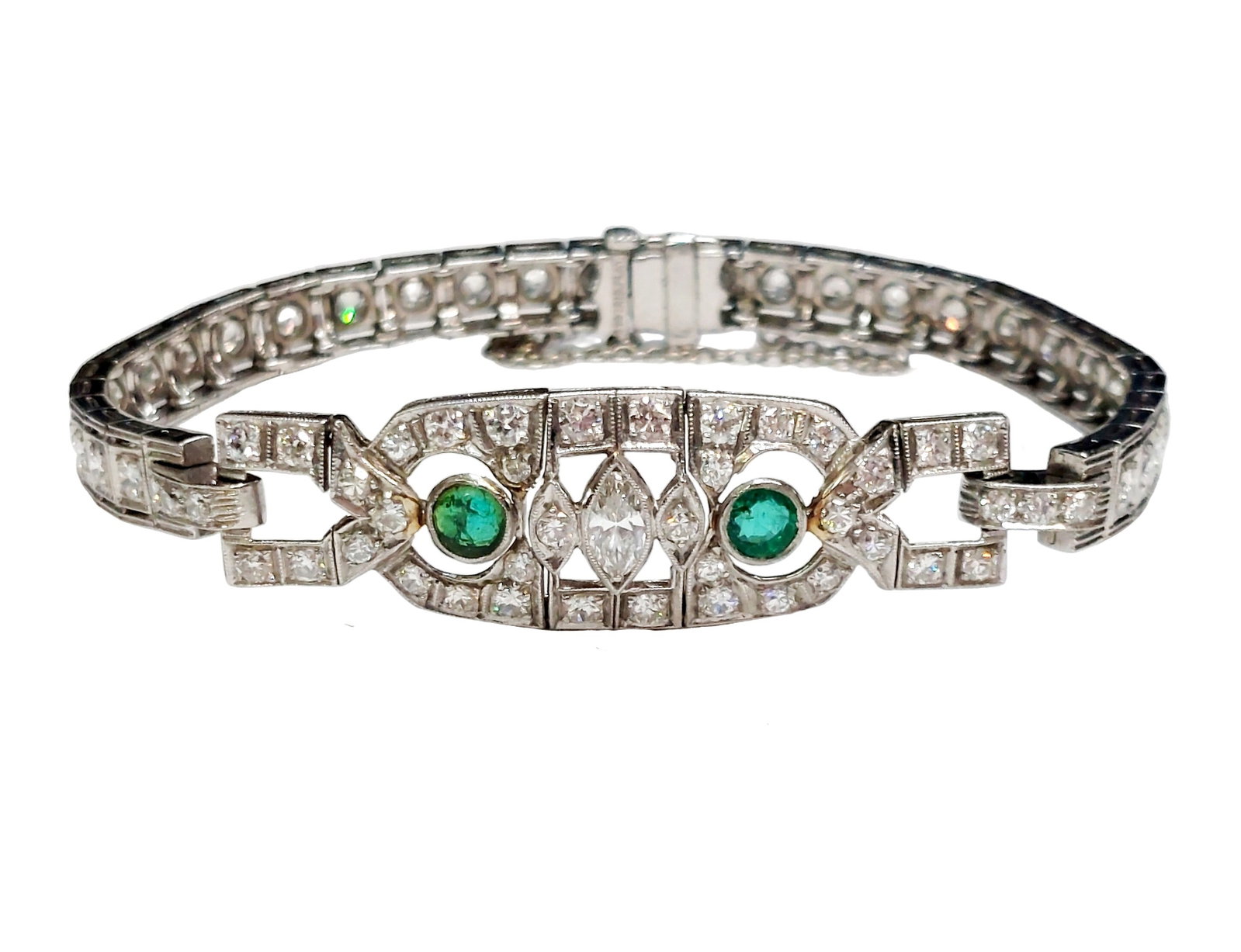 Art Deco Era Fine Diamond Natural Emerald Platinum Filigree Antique Bracelet: Described By: Chris Falconer NFYDD Title: Art Deco Era Fine Diamond Natural Emerald Platinum Filigree Antique Bracelet Description: A genuine Art Deco era platinum link bracelet that is encrusted with