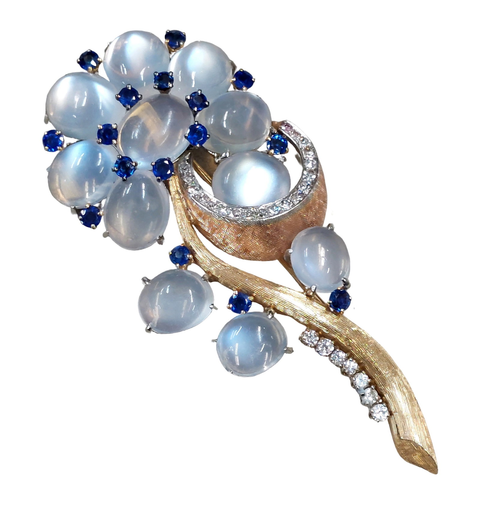 Incredible GIA Burma No Heat Sapphire Fine Diamond Moonstone 14k Yellow Rose Gold Retro Deco Flower: Described By: Chris Falconer NOFED Title: Incredible GIA Burma No Heat Sapphire Fine Diamond Moonstone 14k Yellow Rose Gold Retro Deco Flower Brooch Description: This large flower motif brooch is comp