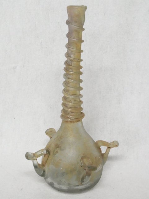 Ancient Roman Art Glass Antiquity 4 Ribbon Handled Ungu: Ancient Roman Art Glass Antiquity 4 Ribbon Handled Unguentaria Rhineland or Cologne Type Bottle With Trailed Coiled Collar This exquisite example of Roman glass comes from a class of antiquities known